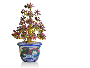 Tree made of old jewelry in blue ceramic pot on white background,object background,religion background, copy spac