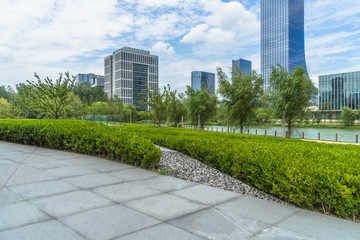 beautiful green meadow near modern office building.