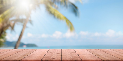 Empty wood table top and blurred summer beach with blue sea and sky banner background. - can used...