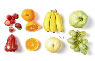 Fresh fruits in raws on white background. Red, orange, yellow and green. Food ingredients, detox