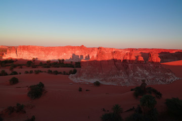 Sunrise at sandstone formation in the Sahara desert near Yoa Lake group of Ounianga Kebir, Ennedi, Chad