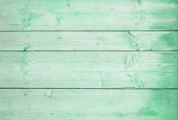 wooden horizontal boards painted green. green wooden background