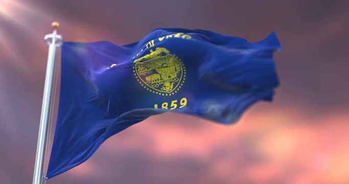 Flag of american state of Oregon waving at sunset - loop
