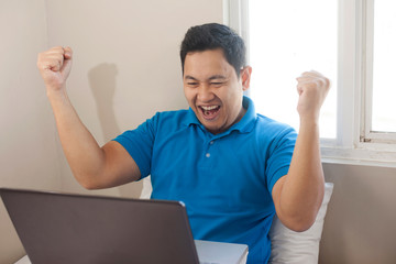 Successful Man Celebrating Victory, Entrepreneur Working Online Business From Home