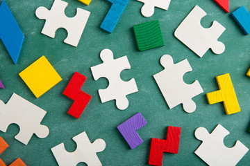 Creative solution for idea - business concept, jigsaw puzzle on the blackboard