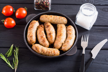 Grilled sausages with tomatoes , pepper and rosemary