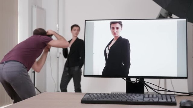 Shooting tethering in professional photo studio. The images are displayed on the screen of the computer