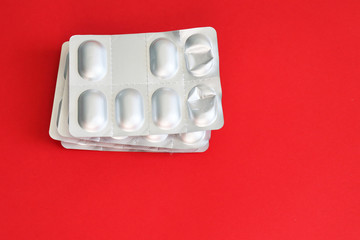 Different medicines: tablets, pills in blister pack, medications drugs, selective focus, copy space