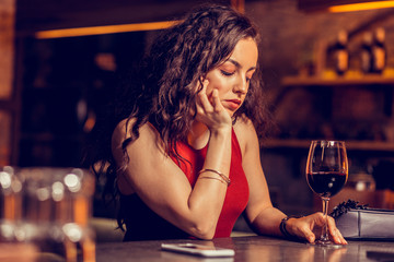 Woman with natural makeup feeling bad sitting alone