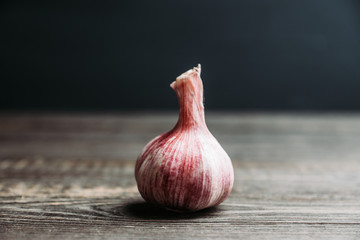Garlic close-up shot on the rustic background. Selective focus. Shallow depth of field.
