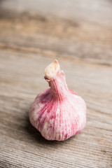Garlic close-up shot on the rustic background. Selective focus. Shallow depth of field.