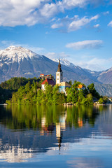 Church on island reflected in waters of Bled Lake
