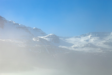 Fototapeta na wymiar Foggy landscape of the fjords of Iceland