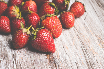 Ripe strawberries on the rustic background. Selective focus.