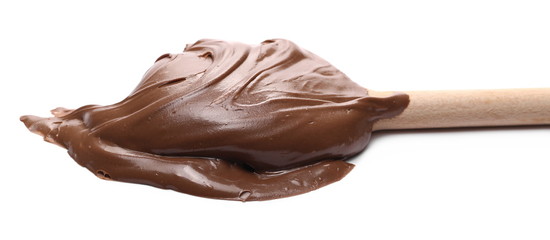 Cream chocolate spread with wooden spoon isolated on white background