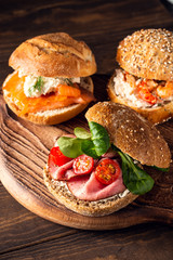 Sandwiche with beef, fresh tomatoes and lamb's lettuce, multigrain bun. Healthy lunch concept