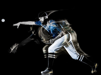 one caucasian baseball player man  studio shot isolated on black background with light painting speed effect