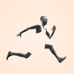 Young caucasian man running isolated on studio background. One male runner or jogger. Healthy...