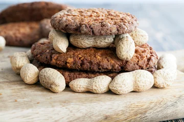 Fotobehang Oatmeal cookies with crushed peanuts © rsooll