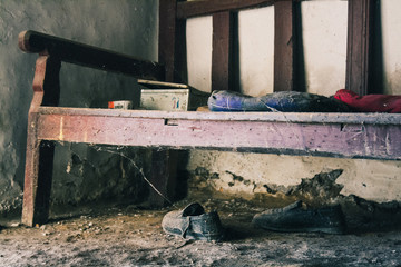 Old wooden bench with spiderwebs.