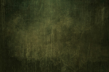 Dark green grungy background or texture