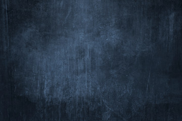 Dark blue grungy background or texture