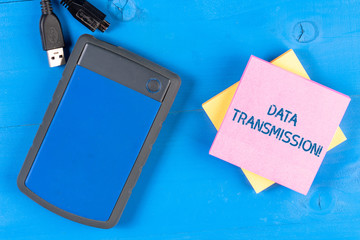 Writing note showing Data Transmission. Business concept for sending data electronically over a communications network Electronic device USB memory colored sticky note pad wooden background