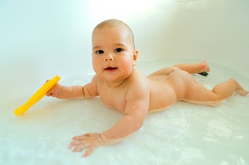 baby in the bath, baby in the water, baby bathing, water treatments, water temperature, joyful child, Children's Day, baby smiles, mother bathes son, boy six months, toys in the bath