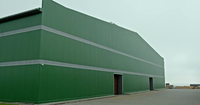 Green metal hangar from low angle