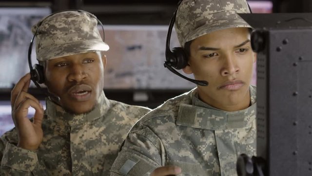 Two drone operators making a hard strike call