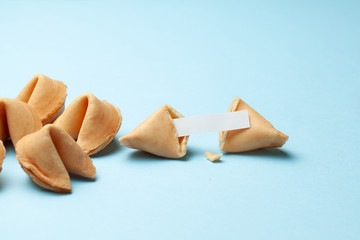 Chinese fortune cookies. Cookies with empty blank inside for prediction words. Blue background.
