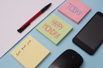 Writing note showing Happy Monday. Business concept for telling that demonstrating order to wish him great new week Note papers and stationary plus gadgets placed sideways above backdrop