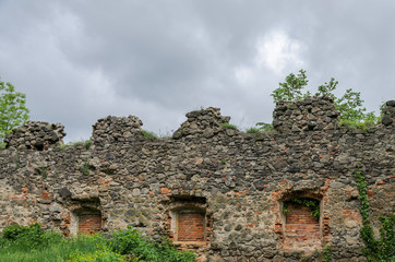 Fototapeta na wymiar Ruins of an old abandoned castle fortress