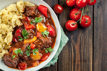 Hungarian beef goulash serwed with galuska noodles