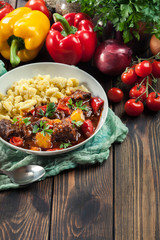 Hungarian beef goulash serwed with galuska noodles