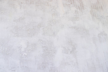 Texture concrete wall with putty. A thin layer of putty. White putty on a gray wall.