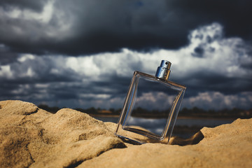 perfume against a cloudy sky