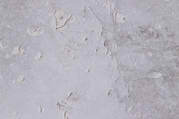 Texture concrete wall with putty. A thin layer of putty. White putty on a gray wall.