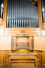 Fototapeta na wymiar Organ, keyboard instrument of more pipe divisions 