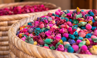 closeup of baskets filled with colorful spices in the market - called souk - of Marrakech, Morocco