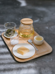 Fototapeta na wymiar Set for tea ceremony with cake sweet traditional on wooden tray, horizontal