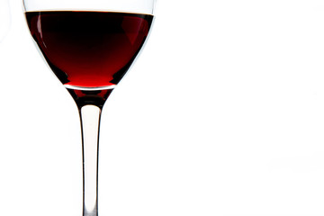 Crystal glasses with red wine on white background. Close up