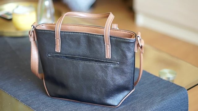 Pickpocket stealing a phone from a small purse