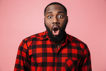 Portrait of a happy african man wearing plaid shirt