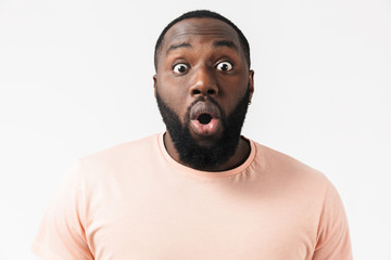 Portrait of a shocked african man wearing plaid shirt