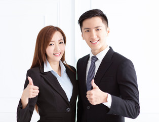 Young smiling business woman and business man