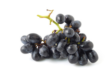 Bunch of black grapes fruit isolated on white background.