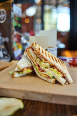 Sandwich set closeup photography, sandwich with vegetables, sausages and melted cheese commercial image