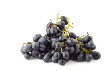 Bunch of black grapes fruit isolated on white background.