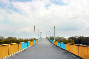 Pedestrian bridge against the sky